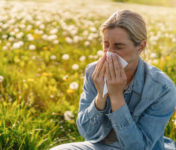 Woman sneezing