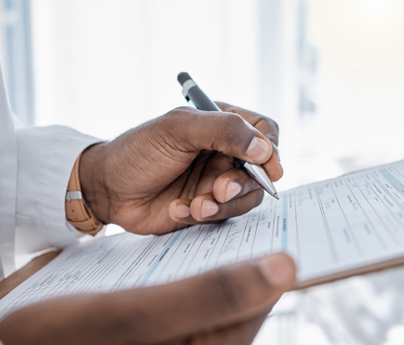 Doctor with clipboard reviewing medical records