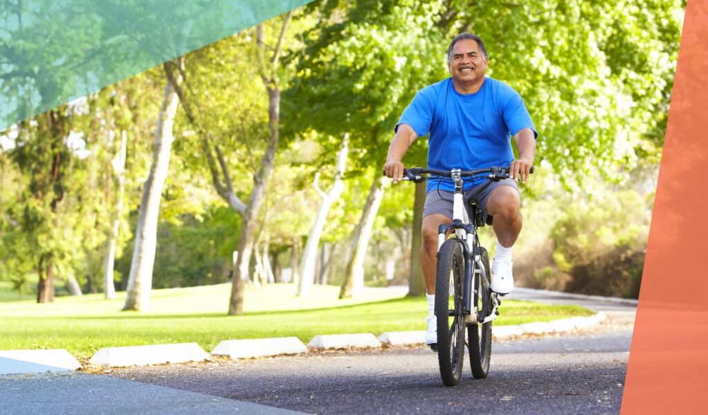 Man riding bike on sunny day showing foot pedaling