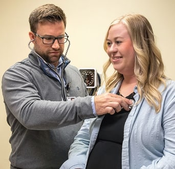Doctor with new patient at first pregnancy appointment