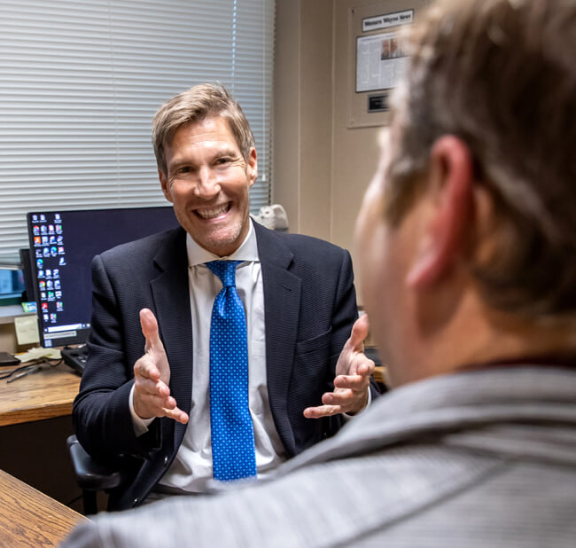 Hip doctor consulting patient