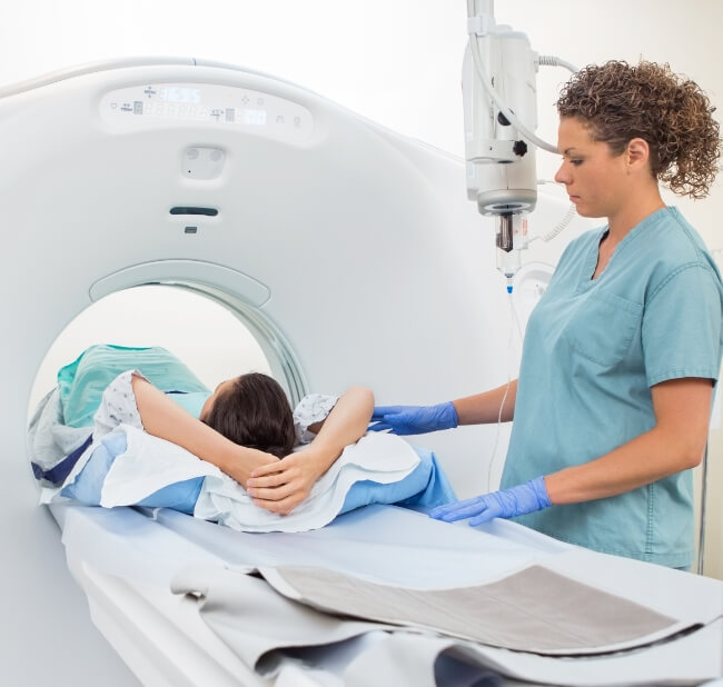 Hospital MRI machine with patient and nurse