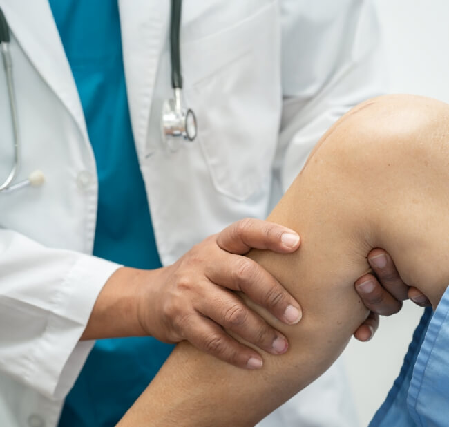 Physician consulting pain patient