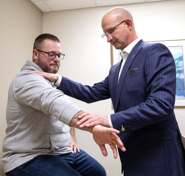 Shoulder physician consulting patient